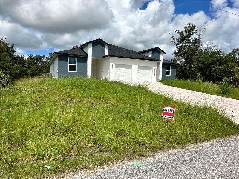Front exterior of a new home in , Port Charlotte, FL, highlighting curb appeal (Image 2). Front exterior of a new home in , Port Charlotte, FL, highlighting curb appeal (Image 2).