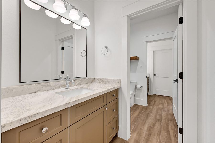Hollywood-style bathroom located between bedrooms four and five.