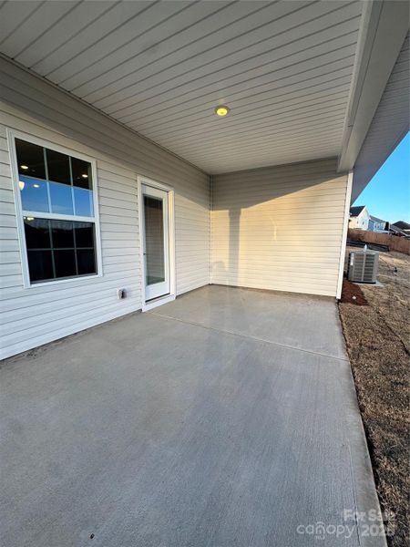 Exterior details and patio area of a home in Village at Parkside, Gastonia (Image 15).