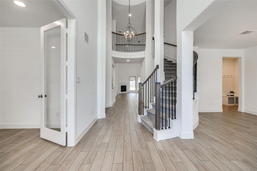 Study to the front of the home with glass doors for privacy, wooden plantation shutters