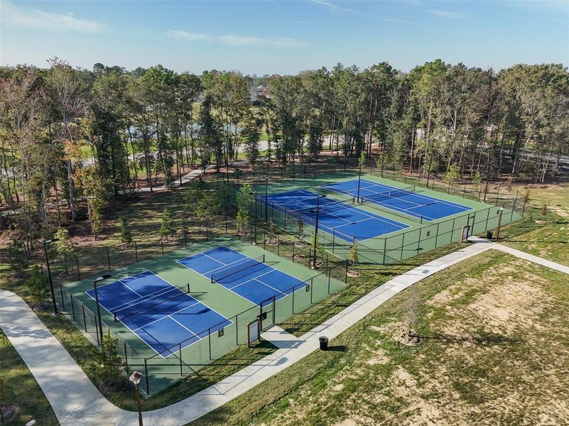 The pickleball and tennis courts offer a vibrant space for friendly matches and active recreation, perfect for staying fit and socializing with neighbors.