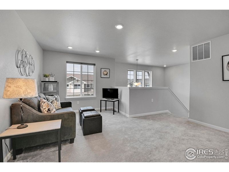 The upstairs Family Room is spacious and inviting!