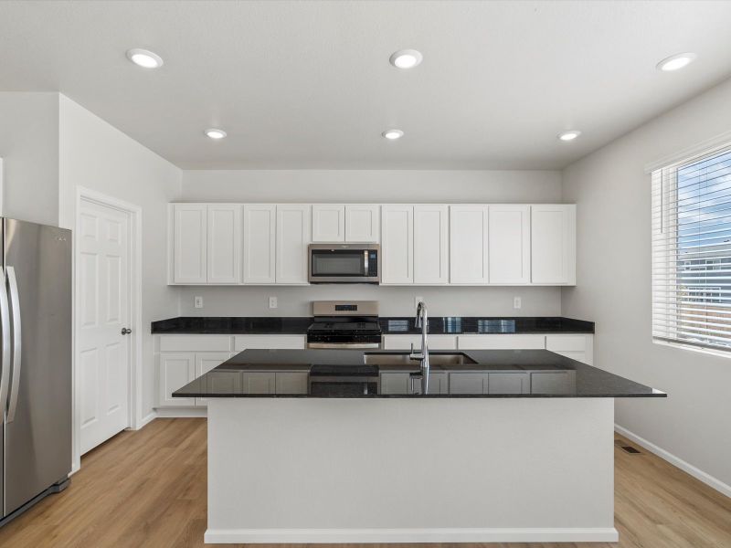 Front exterior of a new home in Paint Brush Hills, Peyton, CO, highlighting curb appeal (Image 2).