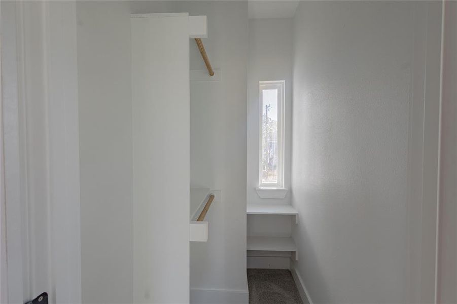 Walk-in Closet in 3rd Bedroom with carpet floors and baseboards Walk-in Closet in 3rd Bedroom with carpet floors and baseboards