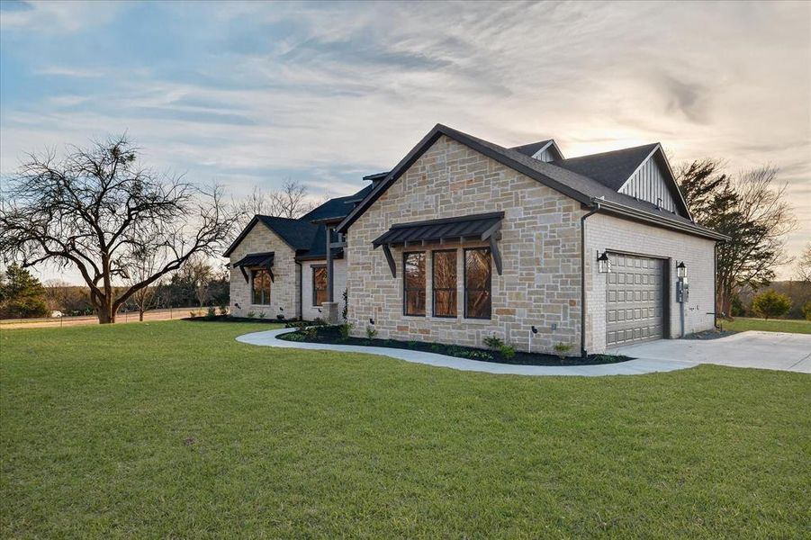 Front exterior of a new home in , Farmersville, TX, highlighting curb appeal (Image 25). Front exterior of a new home in , Farmersville, TX, highlighting curb appeal (Image 25).