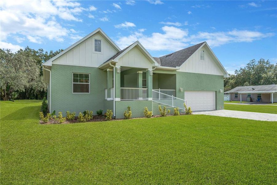 Front exterior of a new home in , Dade City, FL, highlighting curb appeal (Image 24).