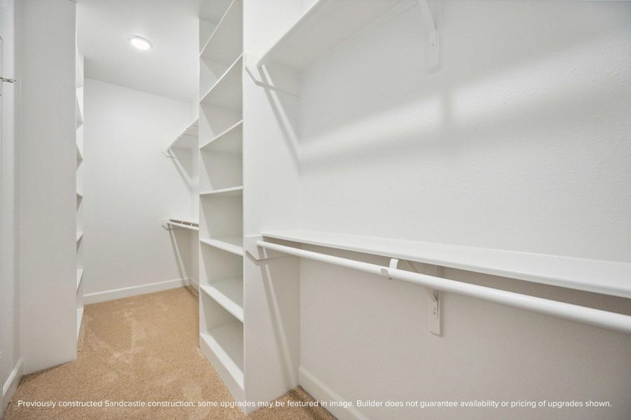 This is just one of two spacious walk-in closets in the primary suite—designed to keep your wardrobe beautifully organized and always within easy reach. This is just one of two spacious walk-in closets in the primary suite—designed to keep your wardrobe beautifully organized and always within easy reach.