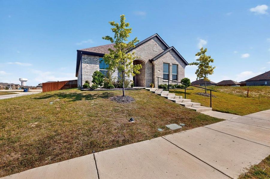 French country inspired facade with brick siding French country inspired facade with brick siding