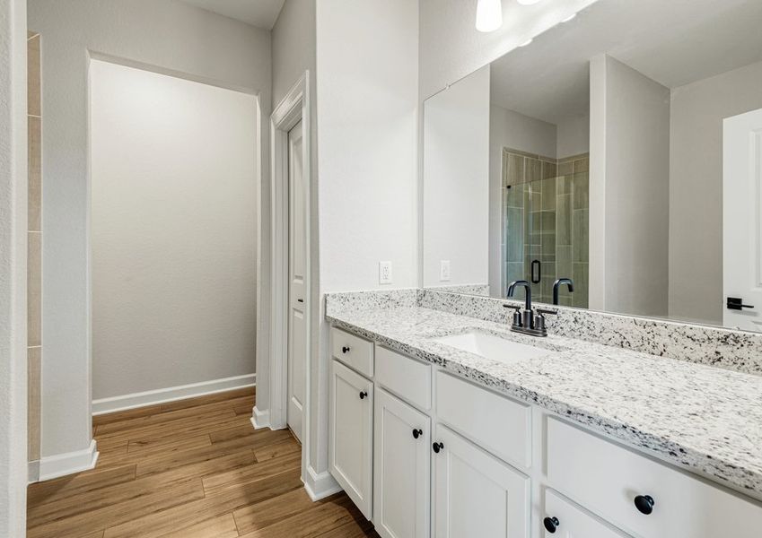 The master bathroom is filled with storage space