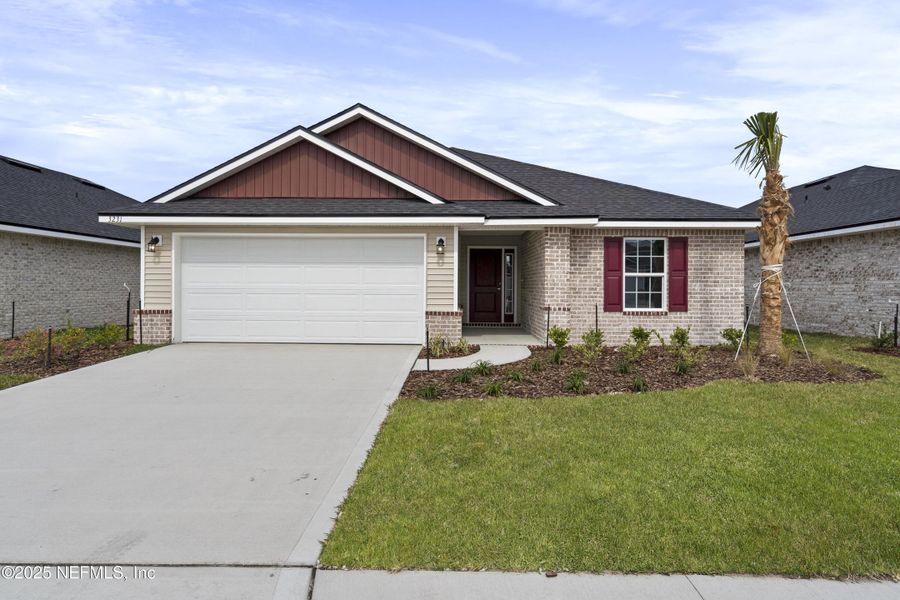 Front exterior of a new home in Shadow Crest at Rolling Hills, Green Cove Springs, FL, highlighting curb appeal (Image 13).