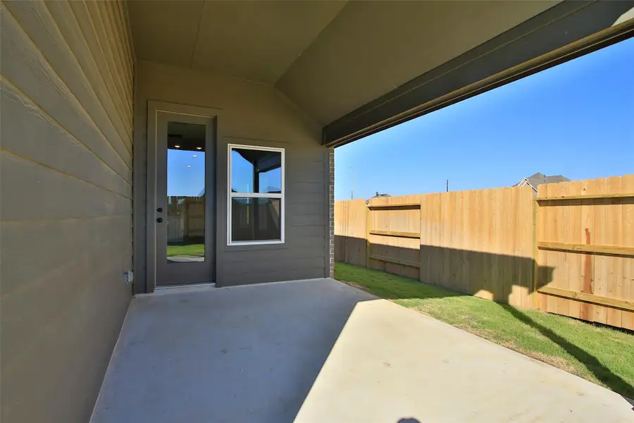 Exterior details and patio area of a home in Oakwood Estates, Waller (Image 2).