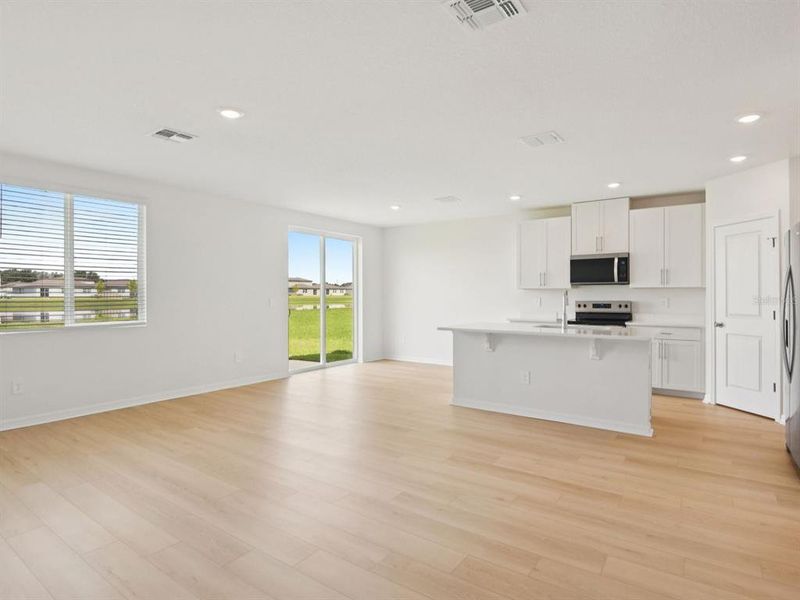 Spacious, unfurnished interior of a new home in The Grove at Stuart Crossing - Classic Series, Bartow (Image 8).