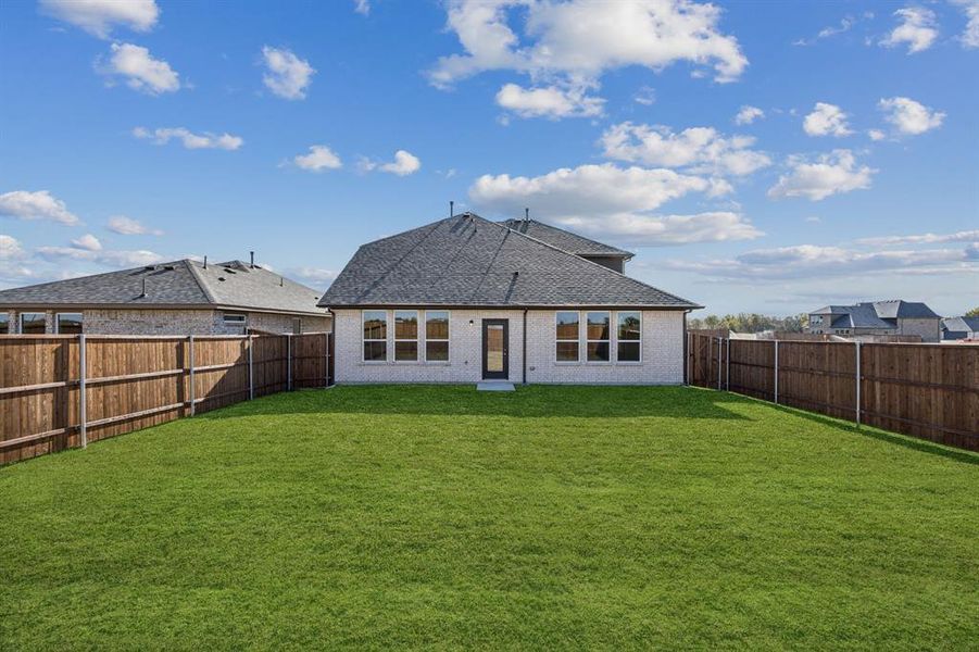 Exterior details and patio area of a home in Santorini, Seagoville (Image 2).