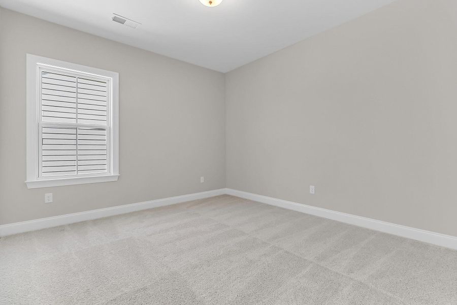 Spacious, unfurnished interior of a new home in Tidewater at Lakes of Cane Bay, Summerville (Image 23).