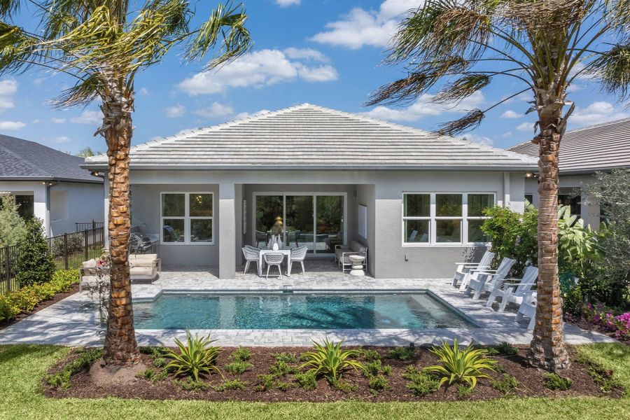Exterior details and patio area of a home in Valencia Ridge, Wesley Chapel (Image 14).