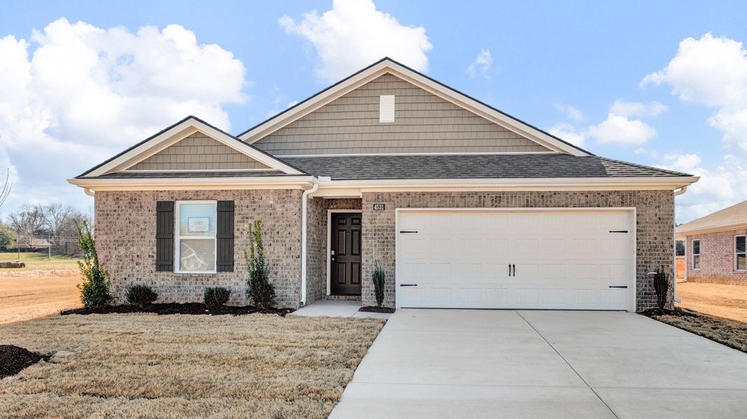 Front exterior of a new home in Riggs Pointe, Millington, TN, highlighting curb appeal (Image 2).