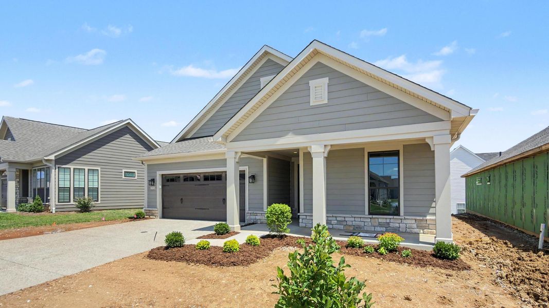 Front exterior of a new home in The Courtyards at Curry Farms, Louisville, KY, highlighting curb appeal (Image 2). Front exterior of a new home in The Courtyards at Curry Farms, Louisville, KY, highlighting curb appeal (Image 2).