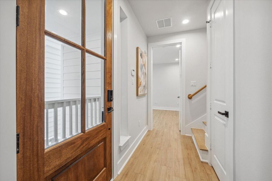 Entry way leading to the 1st floor guest bedroom or home office.