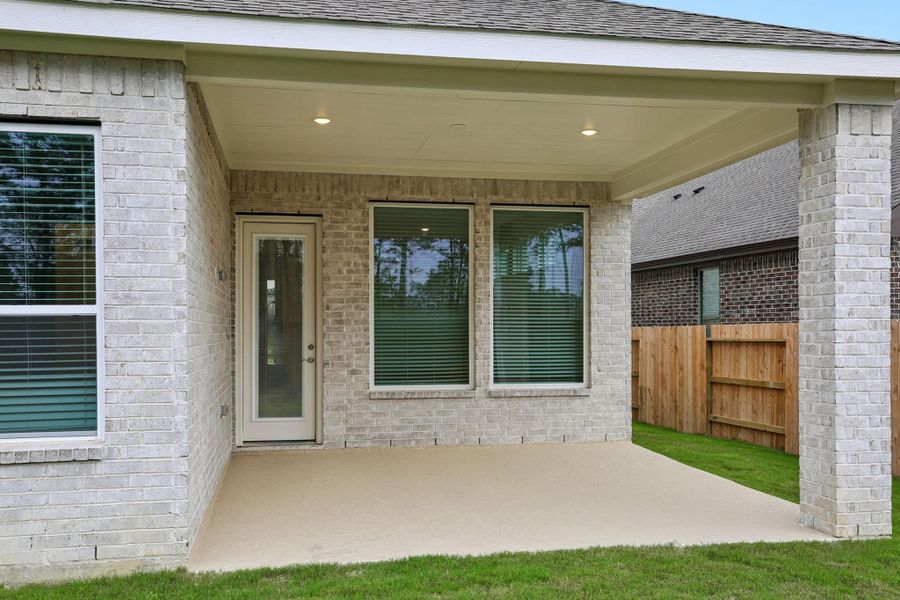 Exterior details and patio area of a home in The Trails, New Caney (Image 29).
