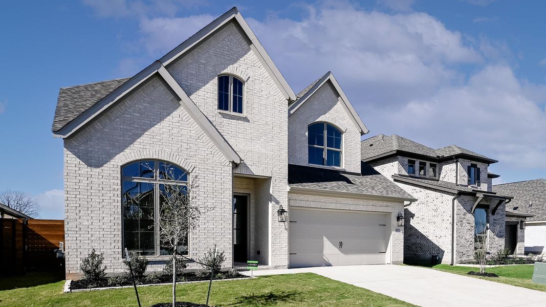 Front exterior of a new home in Juniper Springs, Lockhart, TX, highlighting curb appeal (Image 2).