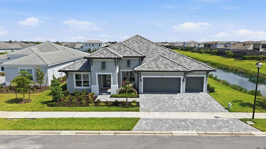 Front exterior of a new home in , Sarasota, FL, highlighting curb appeal (Image 21).
