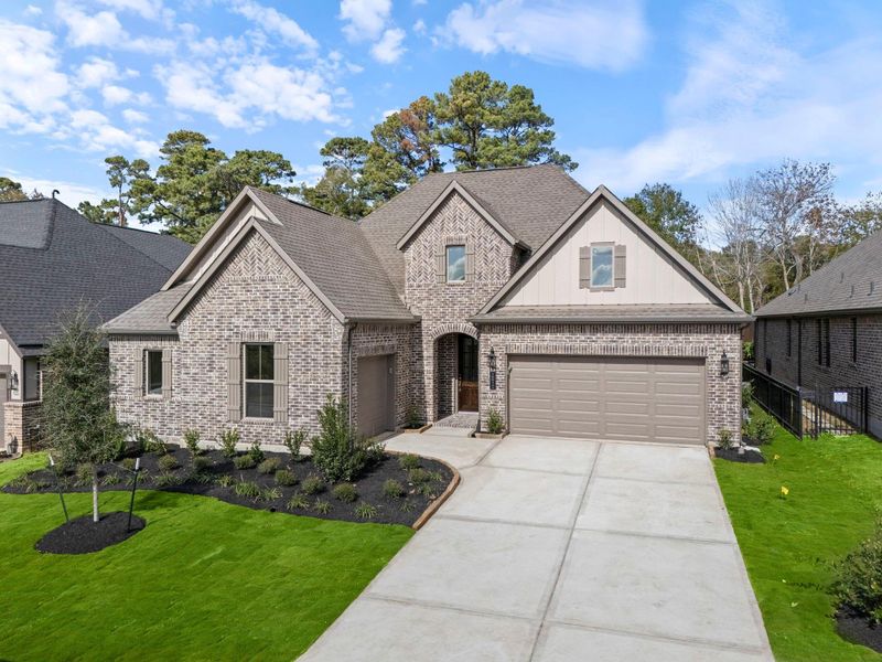 Front exterior of a new home in Chambers Creek, Willis, TX, highlighting curb appeal (Image 2).