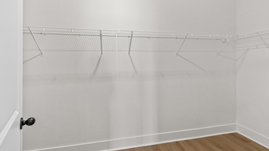 Generous walk-in closet in the primary suite keeps everything organized.