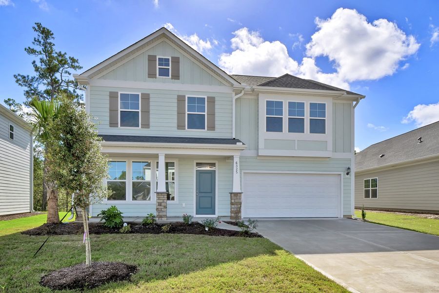 Front exterior of a new home in Grand Park, Leland, NC, highlighting curb appeal (Image 1). Front exterior of a new home in Grand Park, Leland, NC, highlighting curb appeal (Image 1).