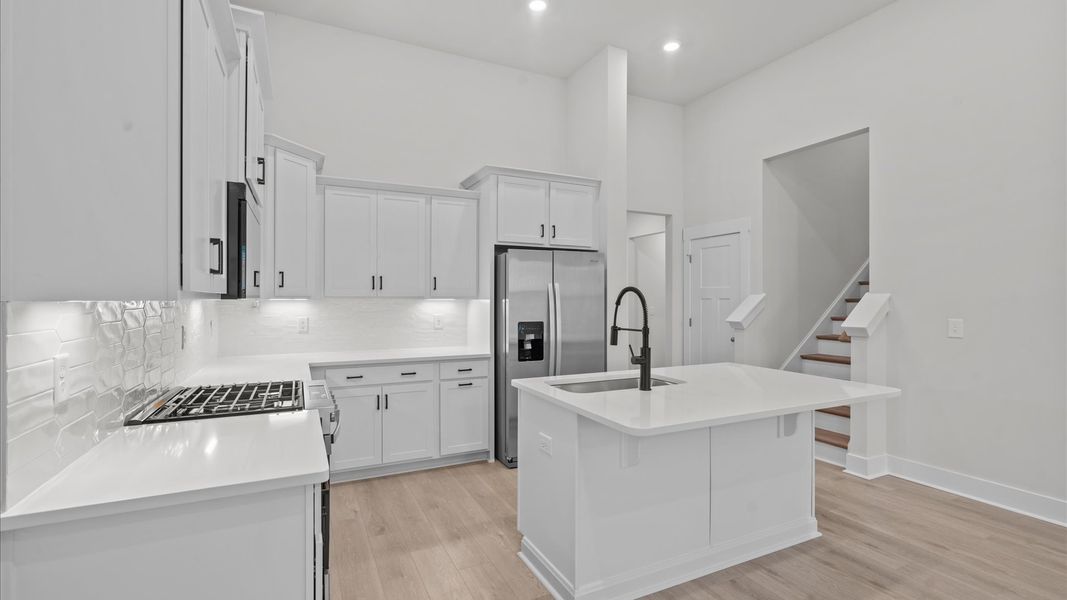 Stunning vaulted ceiling kitchen in two story townhome at Aspen Ridge by DRB Homes in Lyman, SC Stunning vaulted ceiling kitchen in two story townhome at Aspen Ridge by DRB Homes in Lyman, SC