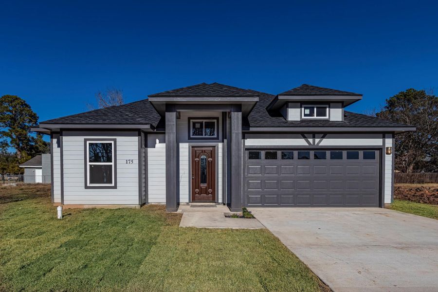 Front exterior of a new home in , Livingston, TX, highlighting curb appeal (Image 27). Front exterior of a new home in , Livingston, TX, highlighting curb appeal (Image 27).