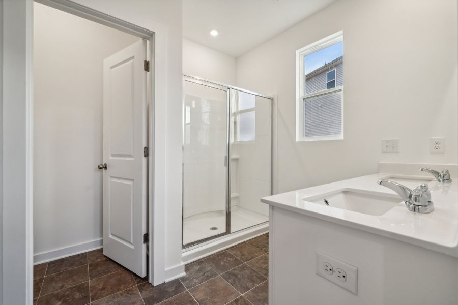 A bathroom with a glass shower.