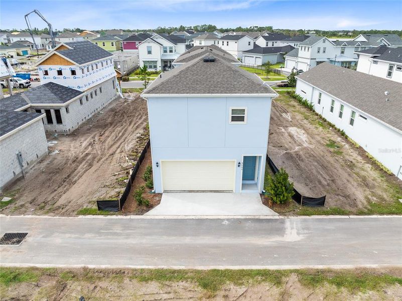 Front exterior of a new home in Laureate Park, Orlando, FL, highlighting curb appeal (Image 21). Front exterior of a new home in Laureate Park, Orlando, FL, highlighting curb appeal (Image 21).