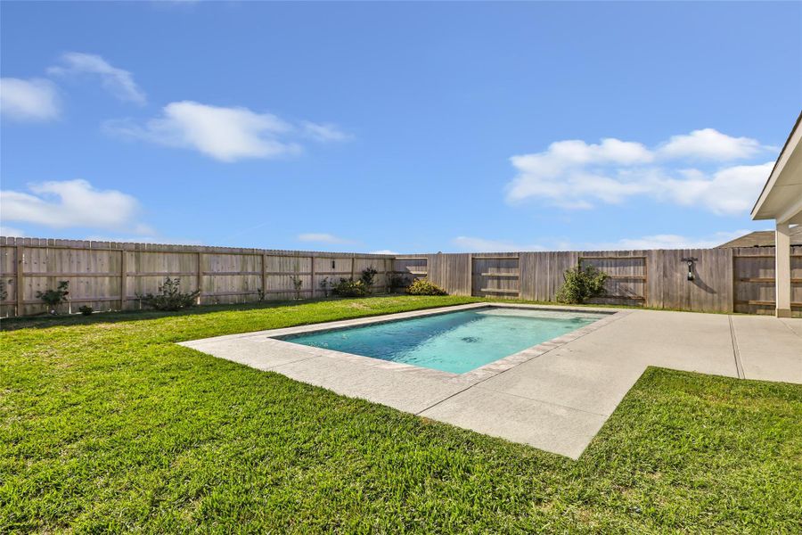 Large back yard provides ample space for kids and fur babies. Look down into the pool - those are turtles at the bottom! Plus water spouts on the side to turn on. Large back yard provides ample space for kids and fur babies. Look down into the pool - those are turtles at the bottom! Plus water spouts on the side to turn on.
