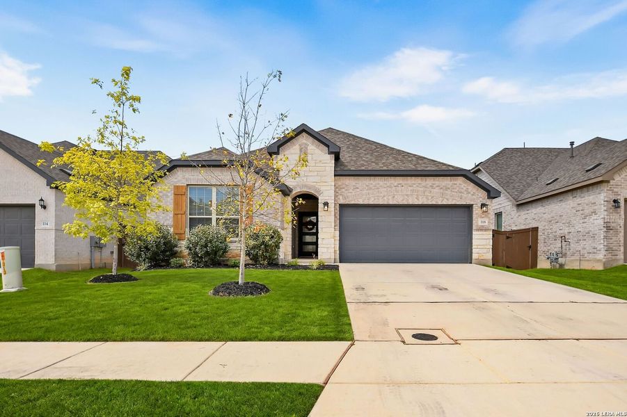 Front exterior of a new home in Corley Farms, Boerne, TX, highlighting curb appeal (Image 2). Front exterior of a new home in Corley Farms, Boerne, TX, highlighting curb appeal (Image 2).