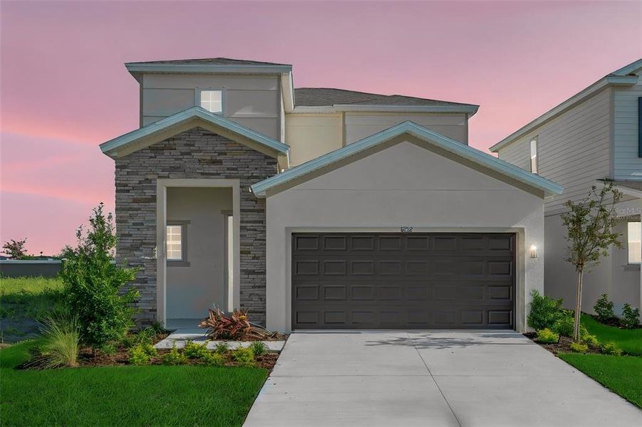 Front exterior of a new home in Seaire, Parrish, FL, highlighting curb appeal (Image 25). Front exterior of a new home in Seaire, Parrish, FL, highlighting curb appeal (Image 25).