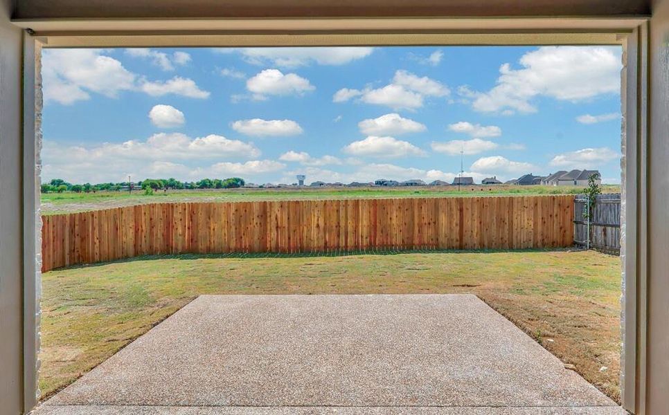 Fenced backyard featuring a patio area