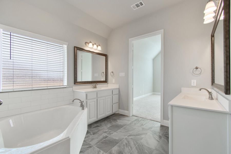 Primary Bathroom | Concept 2623 at The Meadows in Gunter, TX by Landsea Homes