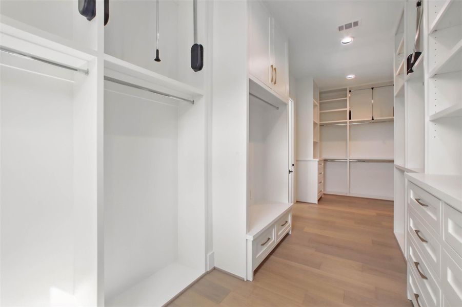 Sample of builder's previous construction. This home will have an upstairs primary suite with an enormous walk-in closet that connects to the upstairs utility room.