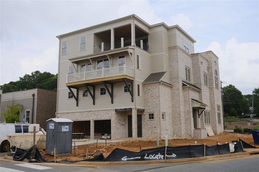 Front exterior of a new home in South on Main, Woodstock, GA, highlighting curb appeal (Image 4).