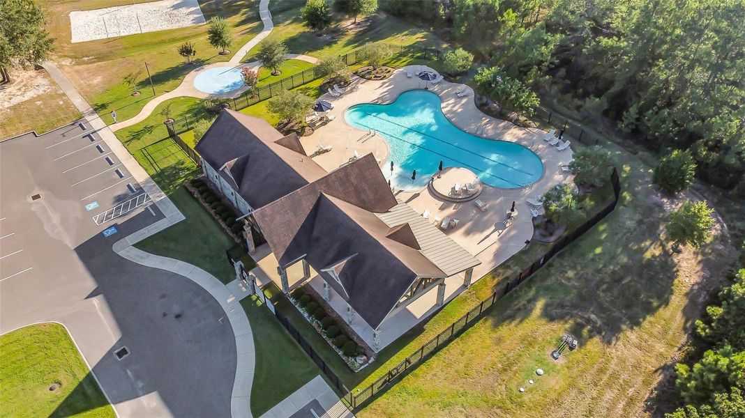 Aerial view of community pool, playground and clubhouse. Aerial view of community pool, playground and clubhouse.