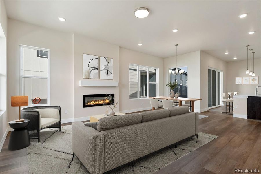 Open layout anchored by the living room with an electric fireplace. Virtually Staged