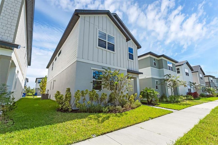 Front exterior of a new home in , St. Cloud, FL, highlighting curb appeal (Image 25).