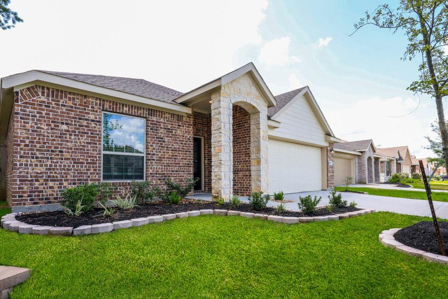 Front exterior of a new home in Ladera Creek, Conroe, TX, highlighting curb appeal (Image 2). Front exterior of a new home in Ladera Creek, Conroe, TX, highlighting curb appeal (Image 2).