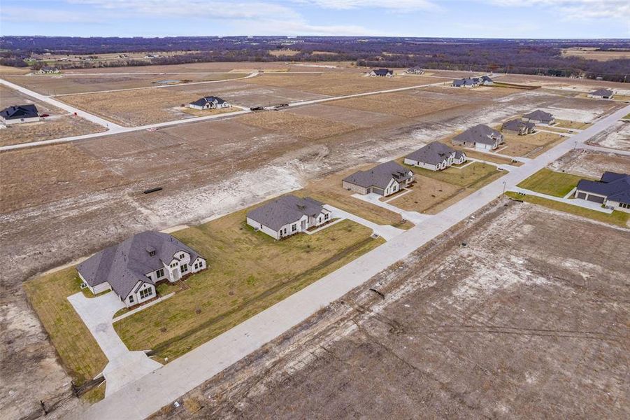 Front exterior of a new home in , Waxahachie, TX, highlighting curb appeal (Image 4).