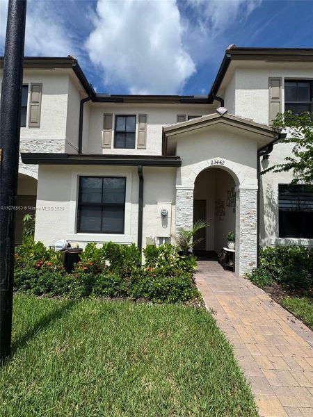 Front exterior of a new home in , Homestead, FL, highlighting curb appeal (Image 17). Front exterior of a new home in , Homestead, FL, highlighting curb appeal (Image 17).