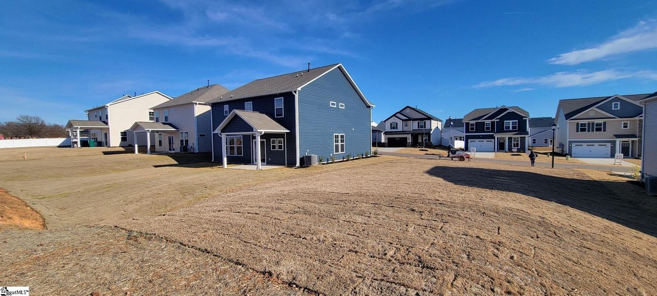 Exterior details and patio area of a home in Halton Oaks, Spartanburg (Image 18).