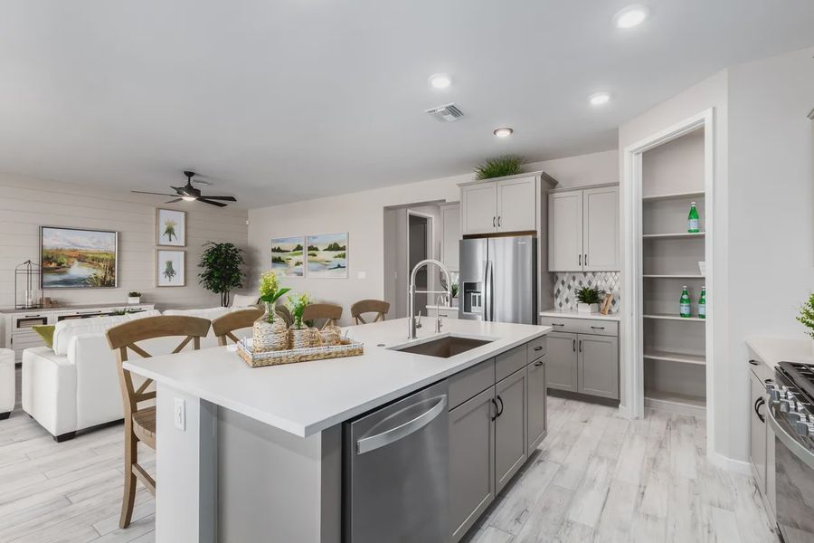 Representative furnished interior of a home built from the 2326 by Elliott Homes in Acacia at Santana, Yuma (Image 16).