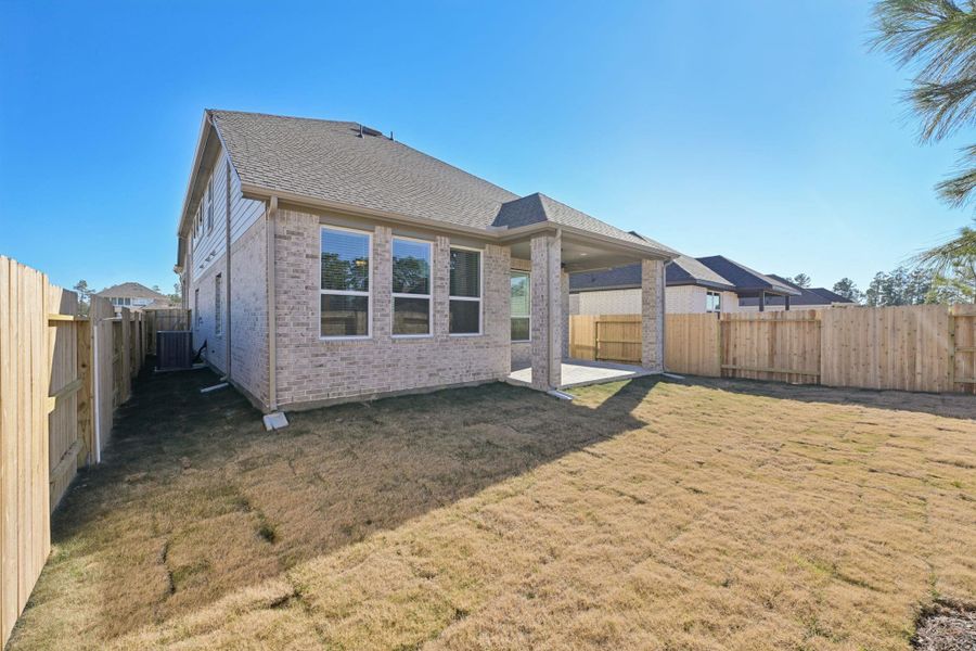 Exterior details and patio area of a home in Evergreen, Conroe (Image 19).