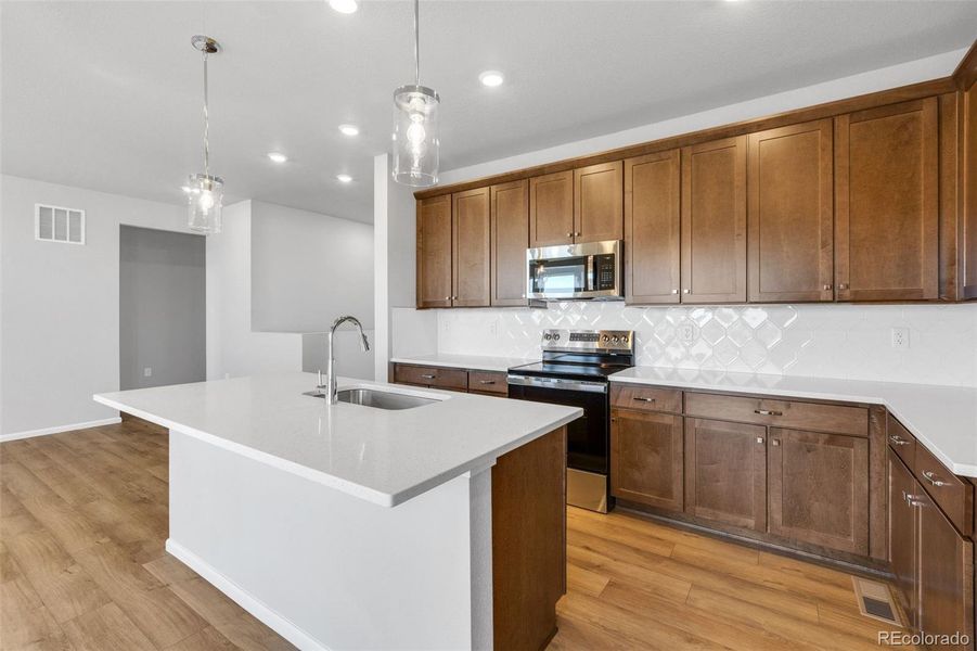 Furnished interior view inside a new home in The Legacy Collection at Talon Pointe, Thornton (Image 6).