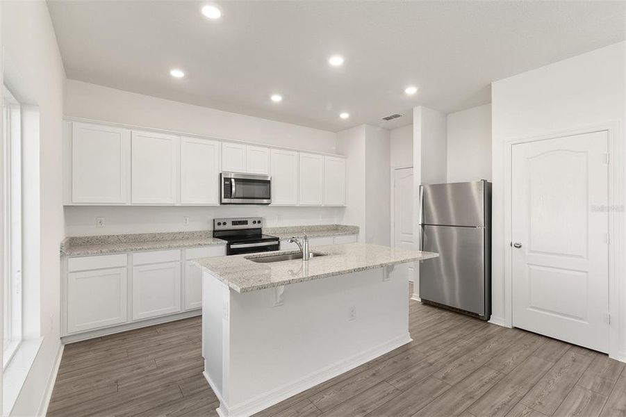 Furnished interior view inside a new home in Peach Crossings, Winter Haven (Image 8).